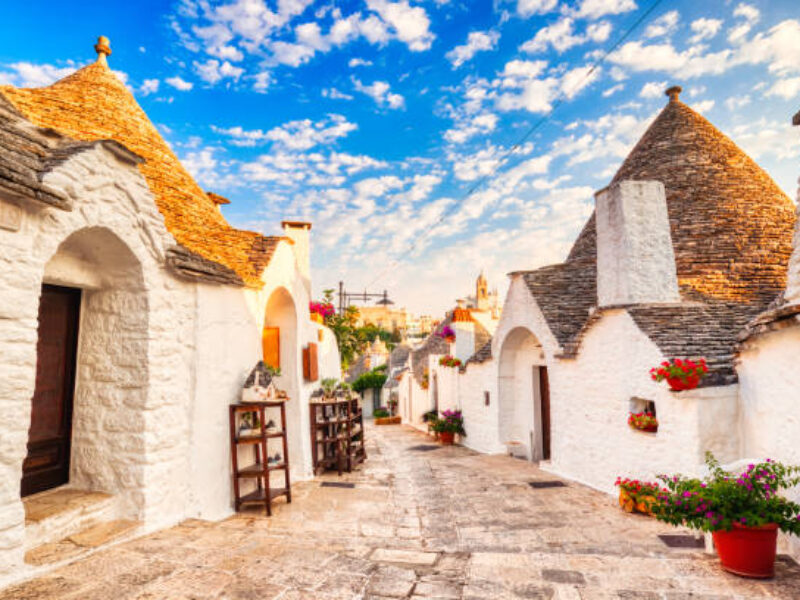 Famous Trulli Houses during a Sunny Day with Bright Blue Sky in Alberobello, Puglia, Italy